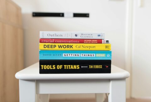 several books on top of table inside room
