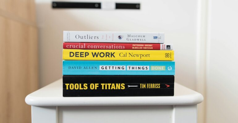 several books on top of table inside room
